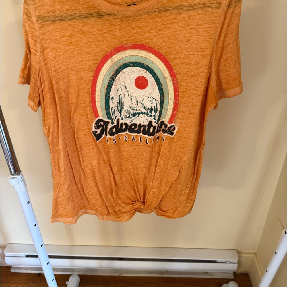 Vibrant Orange Short Sleeve Tee with Retro Rainbow Design